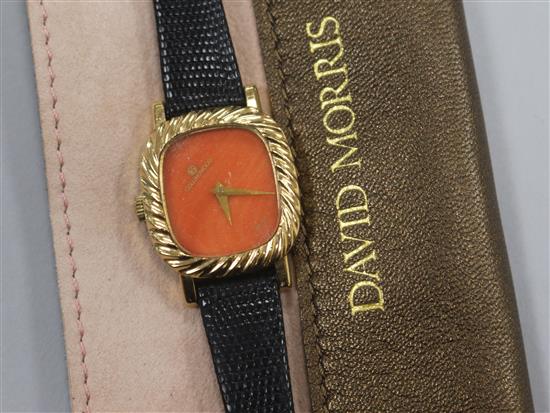 A ladys 9ct gold Collingwood wrist watch with blind coral dial and spiral fluted bezel, retailed by David Morris,